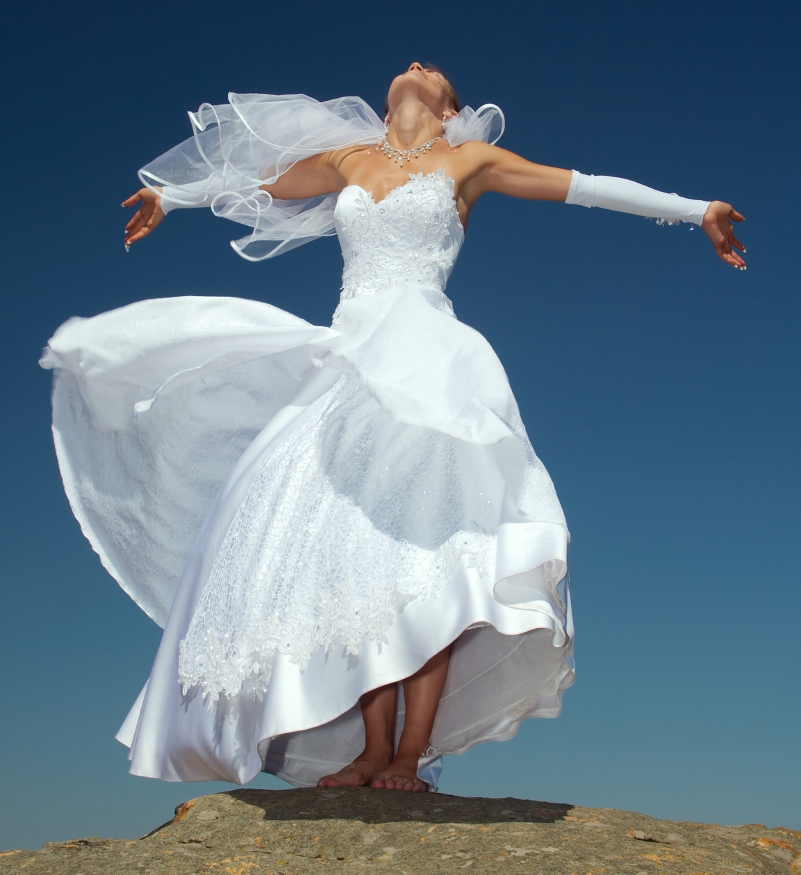 Auburn Young Bride Girl with Bare Feet wearing White Long Lace Dress